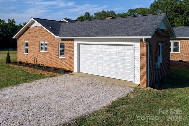 exterior space with a front lawn, driveway, brick siding, and roof with shingles
