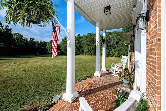 view of yard featuring covered porch