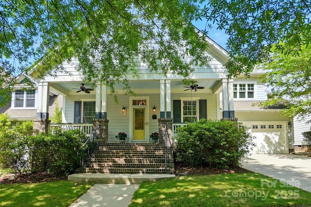 craftsman-style house with an attached garage, a front lawn, a porch, a ceiling fan, and driveway