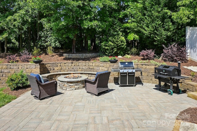 view of patio / terrace featuring a fire pit and a grill