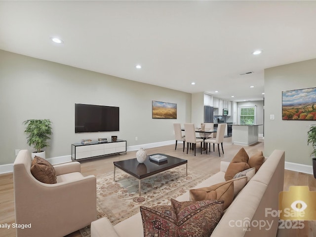 7004 Quail Hill Rd, Charlotte, NC 28210 - living room featuring baseboards, visible vents, light wood finished floors, and recessed lighting