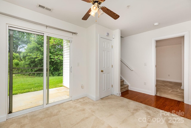3158 Walnut Park Dr, Charlotte, NC 28262 - spare room featuring carpet flooring, ceiling fan, baseboards, stairs, and a smoke detector