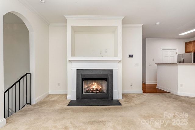 3158 Walnut Park Dr, Charlotte, NC 28262 - unfurnished living room featuring carpet floors, a fireplace with flush hearth, baseboards, and crown molding