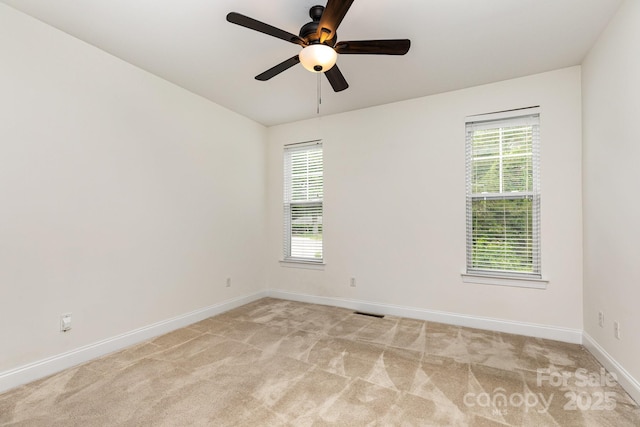 3158 Walnut Park Dr, Charlotte, NC 28262 - unfurnished room with baseboards, ceiling fan, and light carpet