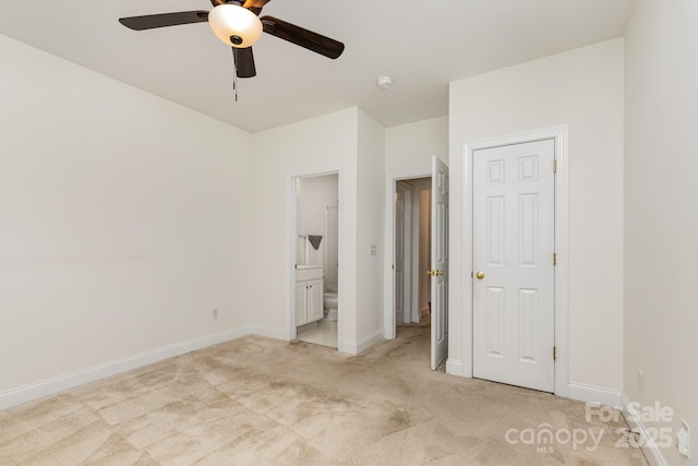 3158 Walnut Park Dr, Charlotte, NC 28262 - unfurnished bedroom with light colored carpet, baseboards, ensuite bathroom, and a ceiling fan