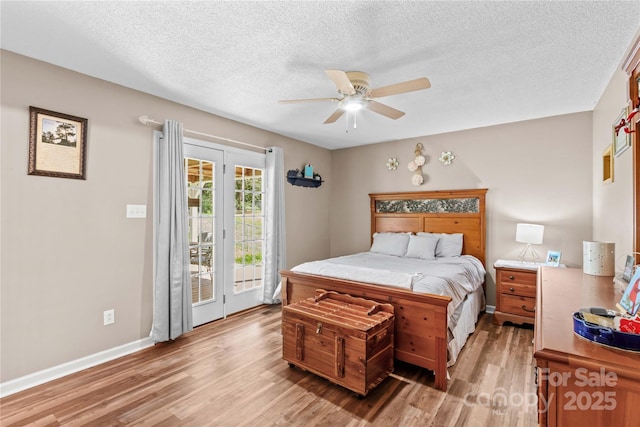 bedroom with light wood finished floors, access to exterior, a ceiling fan, baseboards, and a textured ceiling