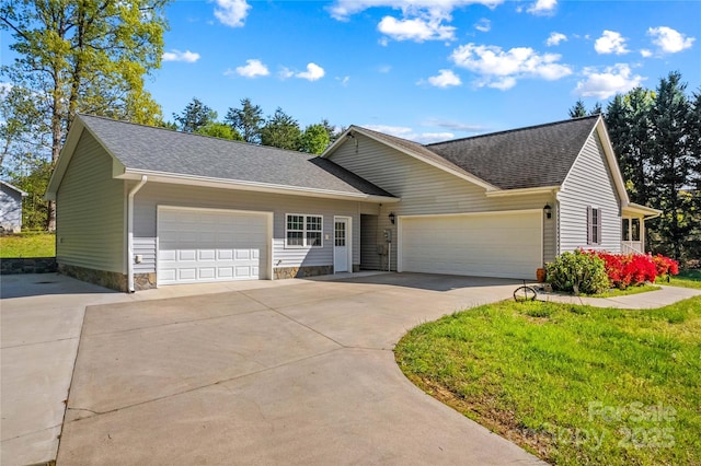 view of front of home featuring concrete driveway, a front lawn, roof with shingles, and a garage