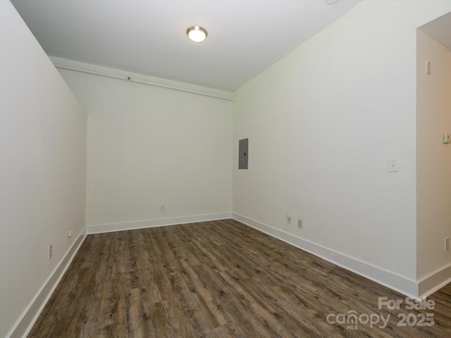 1611 Central Ave Unit 406, Charlotte, NC 28205 - spare room featuring dark wood finished floors, baseboards, and electric panel