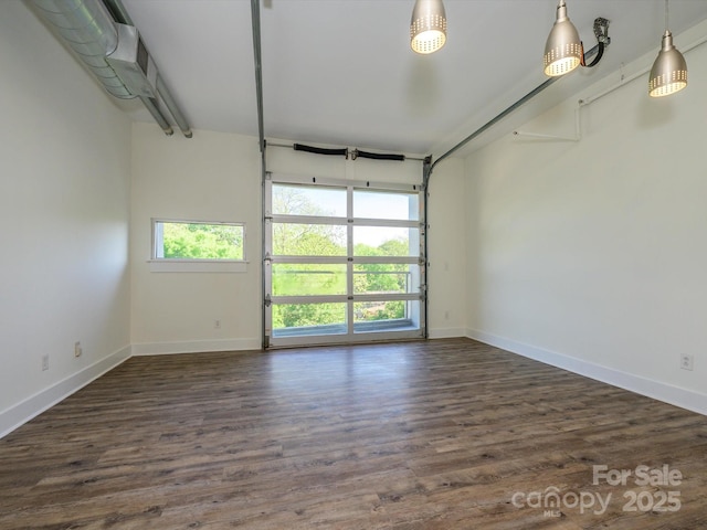 1611 Central Ave Unit 406, Charlotte, NC 28205 - garage with baseboards