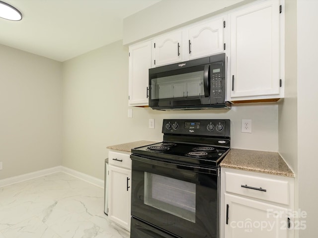 kitchen with marble finish floor, baseboards, white cabinetry, and black appliances