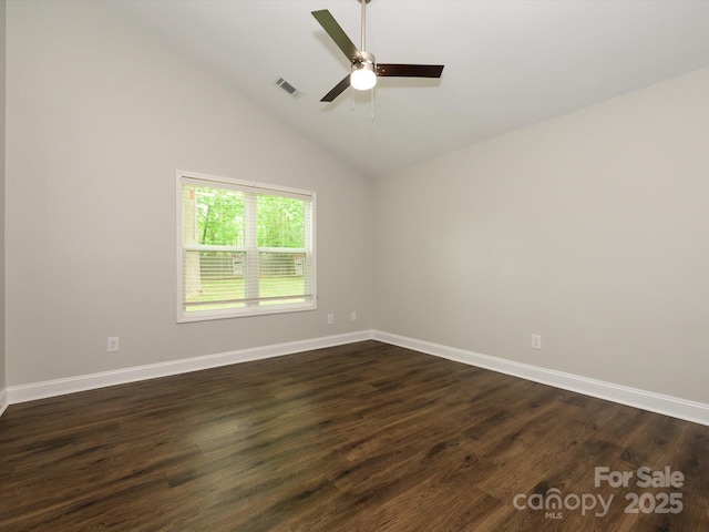 unfurnished room featuring baseboards, a ceiling fan, visible vents, and dark wood-style flooring