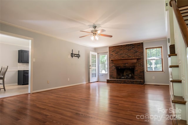 432 Partridge Pl, York, SC 29745 - unfurnished living room with crown molding, a ceiling fan, plenty of natural light, and wood finished floors