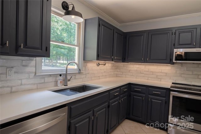 432 Partridge Pl, York, SC 29745 - kitchen with appliances with stainless steel finishes, a sink, light countertops, tasteful backsplash, and crown molding