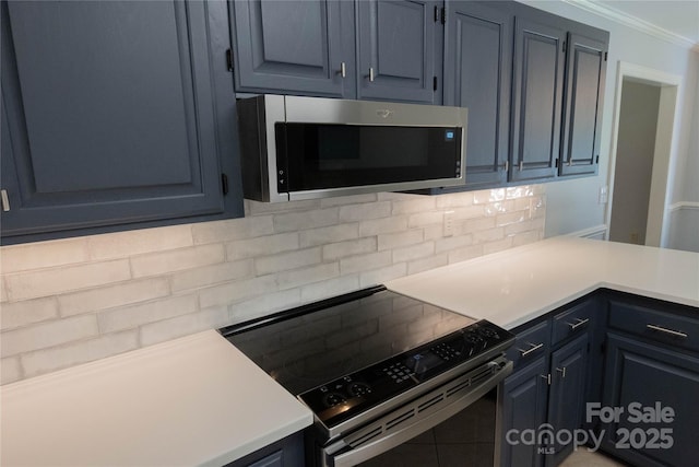 432 Partridge Pl, York, SC 29745 - kitchen featuring stainless steel microwave, range with electric cooktop, tasteful backsplash, crown molding, and light countertops