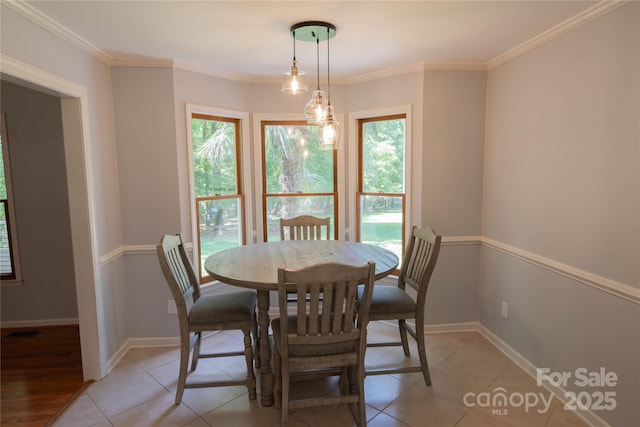 432 Partridge Pl, York, SC 29745 - dining space with healthy amount of natural light, light tile patterned flooring, baseboards, and ornamental molding