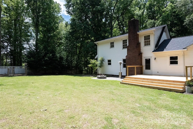 432 Partridge Pl, York, SC 29745 - rear view of house with a chimney, a wooden deck, and a fire pit