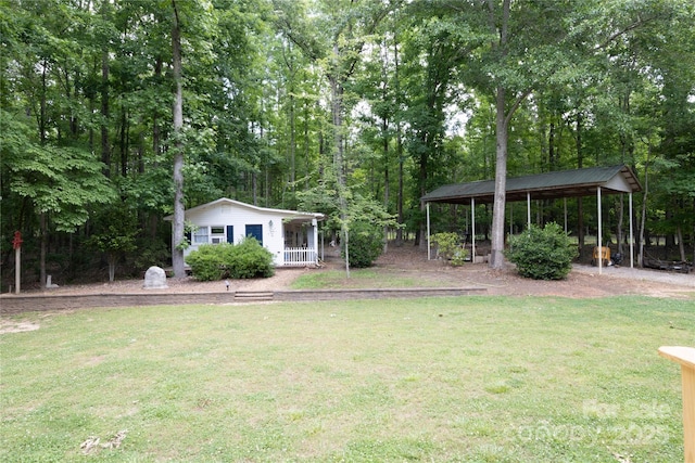 432 Partridge Pl, York, SC 29745 - view of grassy yard featuring a detached carport and covered porch