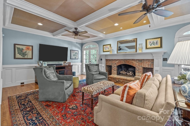 6824 N Baltusrol Ln, Charlotte, NC 28210 - living room featuring ceiling fan, a fireplace, wood finished floors, coffered ceiling, and beamed ceiling