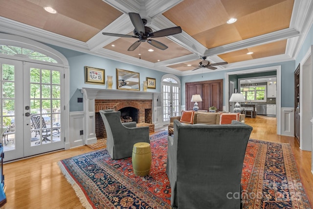 6824 N Baltusrol Ln, Charlotte, NC 28210 - living room with french doors, coffered ceiling, wood finished floors, ornamental molding, and a decorative wall