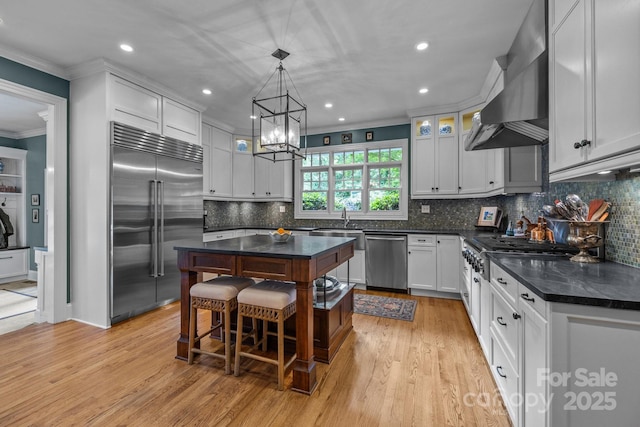 6824 N Baltusrol Ln, Charlotte, NC 28210 - kitchen featuring stainless steel appliances, crown molding, a kitchen island, recessed lighting, and decorative backsplash
