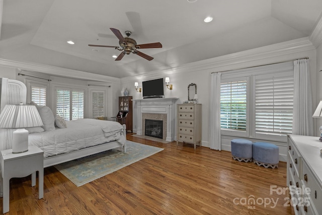 6824 N Baltusrol Ln, Charlotte, NC 28210 - bedroom with a raised ceiling, wood finished floors, a high end fireplace, recessed lighting, and ornamental molding