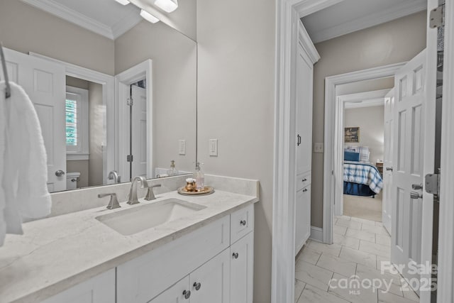 6824 N Baltusrol Ln, Charlotte, NC 28210 - bathroom featuring marble look tile flooring, crown molding, vanity, and baseboards