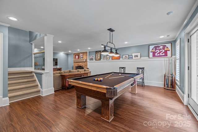 6824 N Baltusrol Ln, Charlotte, NC 28210 - playroom with pool table, wood finished floors, a brick fireplace, recessed lighting, and crown molding