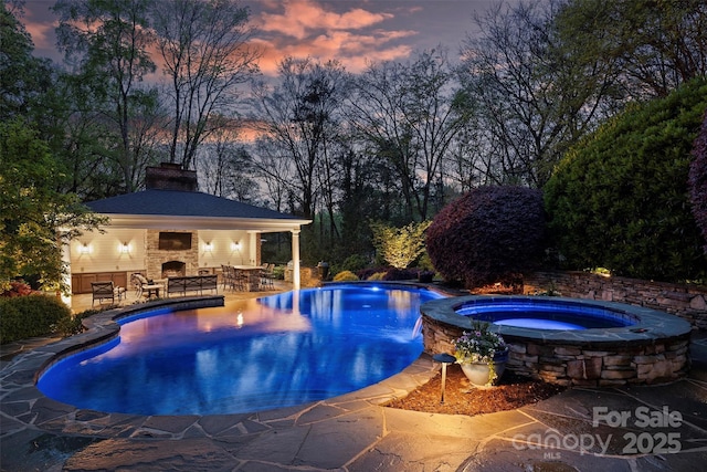 6824 N Baltusrol Ln, Charlotte, NC 28210 - pool at dusk featuring a patio area, a gazebo, and a pool with connected hot tub