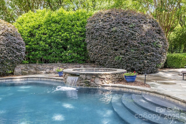 6824 N Baltusrol Ln, Charlotte, NC 28210 - view of pool featuring a pool with connected hot tub and a patio