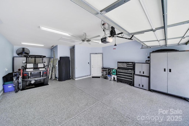 garage featuring ceiling fan and a garage door opener
