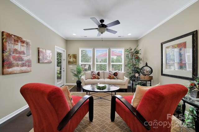 living area featuring baseboards, recessed lighting, ceiling fan, and crown molding