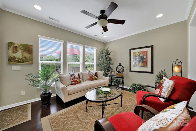 living area with baseboards, wood finished floors, visible vents, and recessed lighting