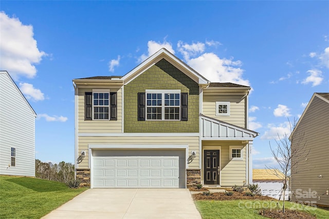 121 Dorian Pl, Troutman, NC 28166 - view of front of home featuring concrete driveway, a garage, stone siding, and a front lawn