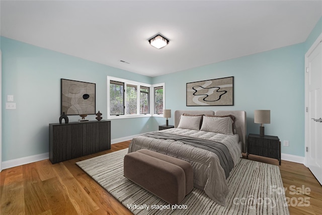 61 Tsataga Ct, Brevard, NC 28712 - bedroom with baseboards, visible vents, and wood finished floors