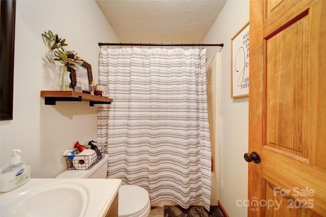 122 Roxboro Ct Unit 286, Mount Gilead, NC 27306 - bathroom featuring vanity, a textured ceiling, curtained shower, and toilet