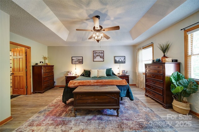 122 Roxboro Ct Unit 286, Mount Gilead, NC 27306 - bedroom with baseboards, a tray ceiling, and wood finished floors