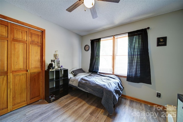 122 Roxboro Ct Unit 286, Mount Gilead, NC 27306 - bedroom featuring a textured ceiling, ceiling fan, and light wood-style floors