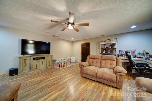 122 Roxboro Ct Unit 286, Mount Gilead, NC 27306 - living room with a textured ceiling, a ceiling fan, recessed lighting, wood finished floors, and visible vents