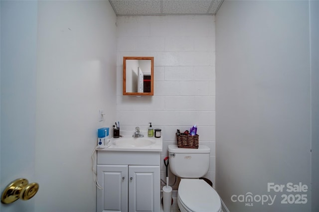 122 Roxboro Ct Unit 286, Mount Gilead, NC 27306 - bathroom featuring vanity, a drop ceiling, and toilet