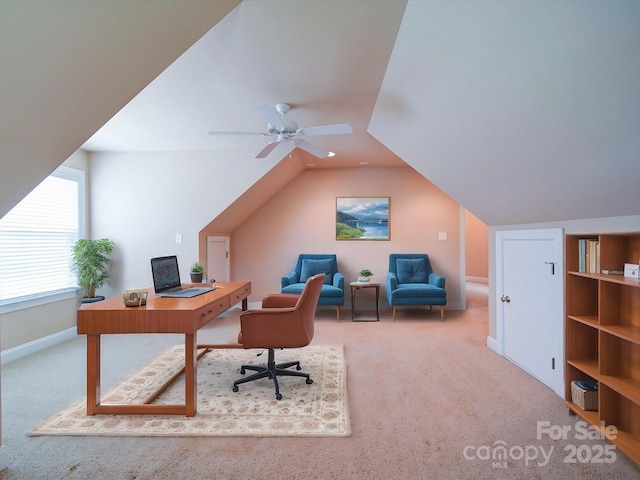 home office featuring vaulted ceiling, carpet, a ceiling fan, and baseboards
