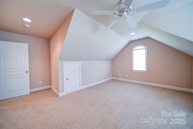 additional living space with recessed lighting, carpet, lofted ceiling, baseboards, and ceiling fan