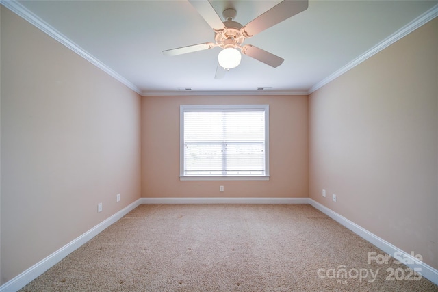 spare room with baseboards, crown molding, light colored carpet, and ceiling fan
