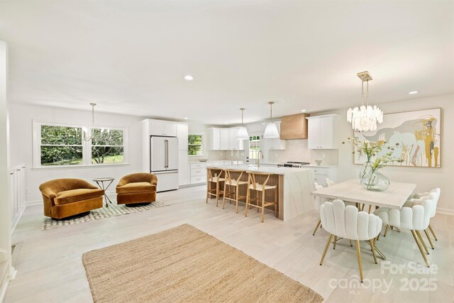 7506 Kilcullen Dr, Charlotte, NC 28270 - dining space with light wood finished floors, baseboards, recessed lighting, and a chandelier