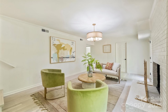 7506 Kilcullen Dr, Charlotte, NC 28270 - living area featuring baseboards, visible vents, wood finished floors, a fireplace, and ornamental molding