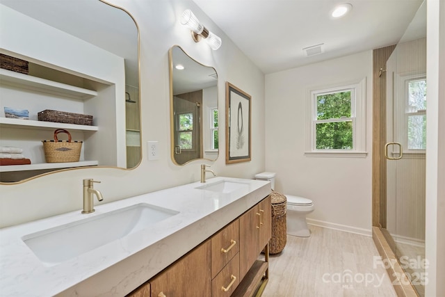 7506 Kilcullen Dr, Charlotte, NC 28270 - bathroom featuring a shower stall, visible vents, wood finished floors, and a sink