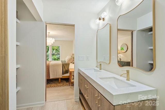 7506 Kilcullen Dr, Charlotte, NC 28270 - bathroom with connected bathroom, a chandelier, a sink, and double vanity