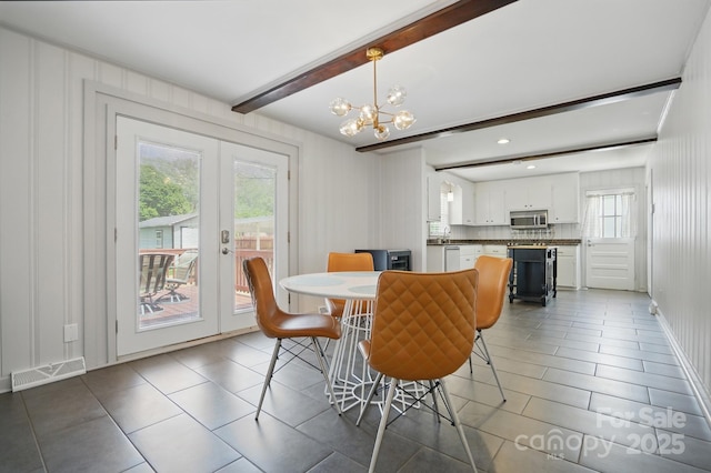 tiled dining room featuring visible vents, an inviting chandelier, beam ceiling, and french doors