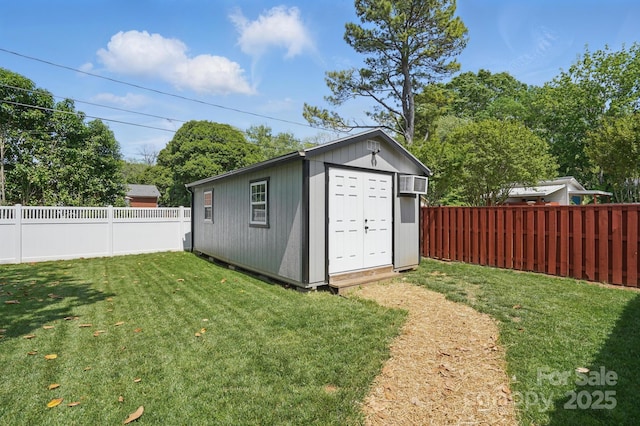 view of shed with a fenced backyard