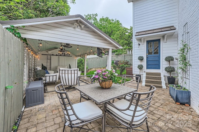 view of patio / terrace with outdoor dining space, a gazebo, ceiling fan, and a fenced backyard