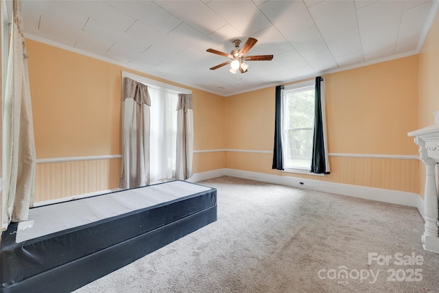 302 Charlotte St, York, SC 29745 - spare room featuring a ceiling fan, crown molding, and carpet